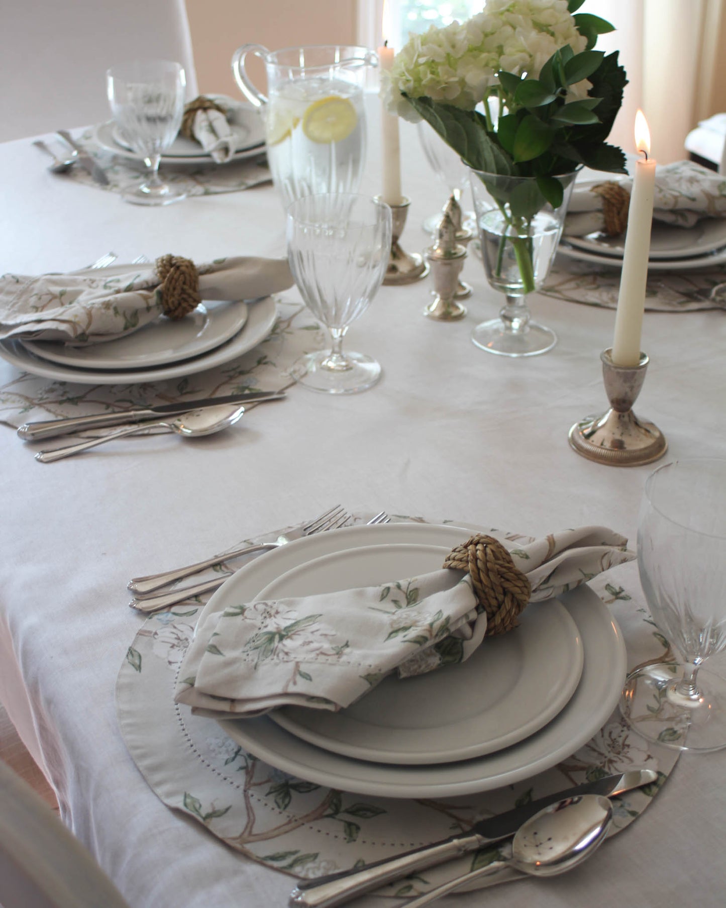 Heirloom-quality Camellia placemats in a traditional floral print, ideal for spring luncheons, holiday dinners, or bridal showers