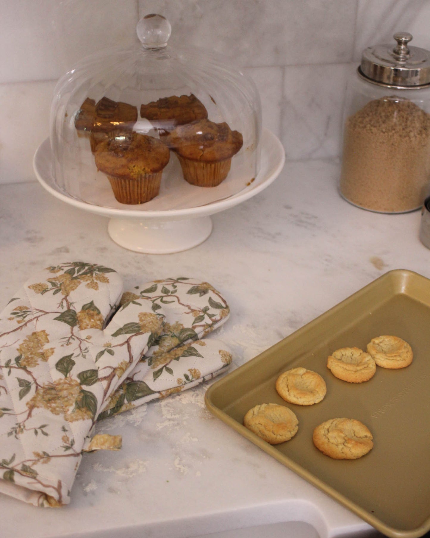 Quilted floral oven mitt pair with heat-resistant lining for baking and cooking