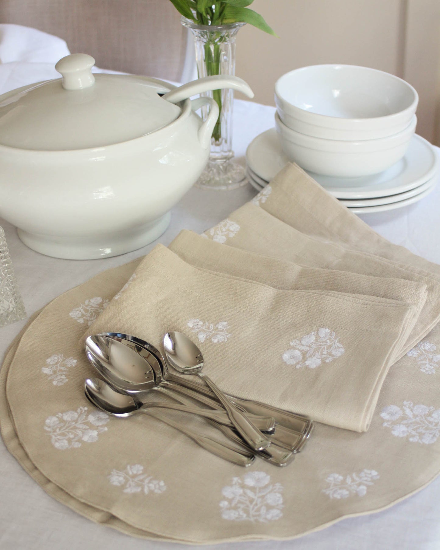 Elegant set of 4 embroidered round placemats featuring delicate floral designs, perfect for Easter and spring table decor. These classic, timeless placemats make a lovely gift for Mom or a charming addition to any dining room or spring celebration.