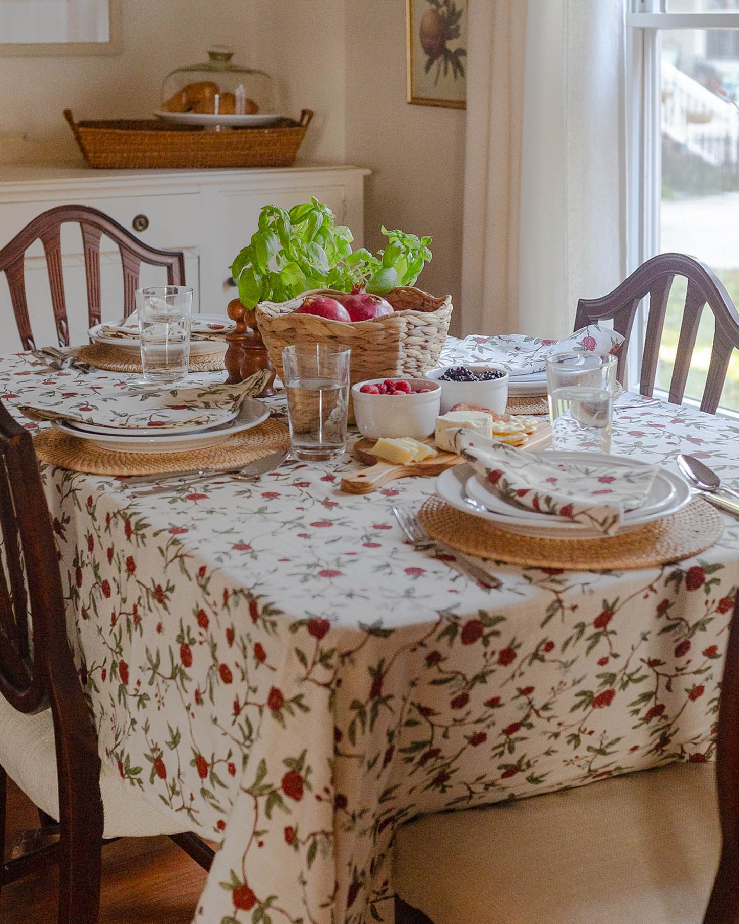 Floral tablecloth in William Morris inspired red and green botanical print for spring hosting decor, featuring a delightful design of charming red flowers and lush green leaves with a hint of blue that compliments your china, all hand-drawn with love.