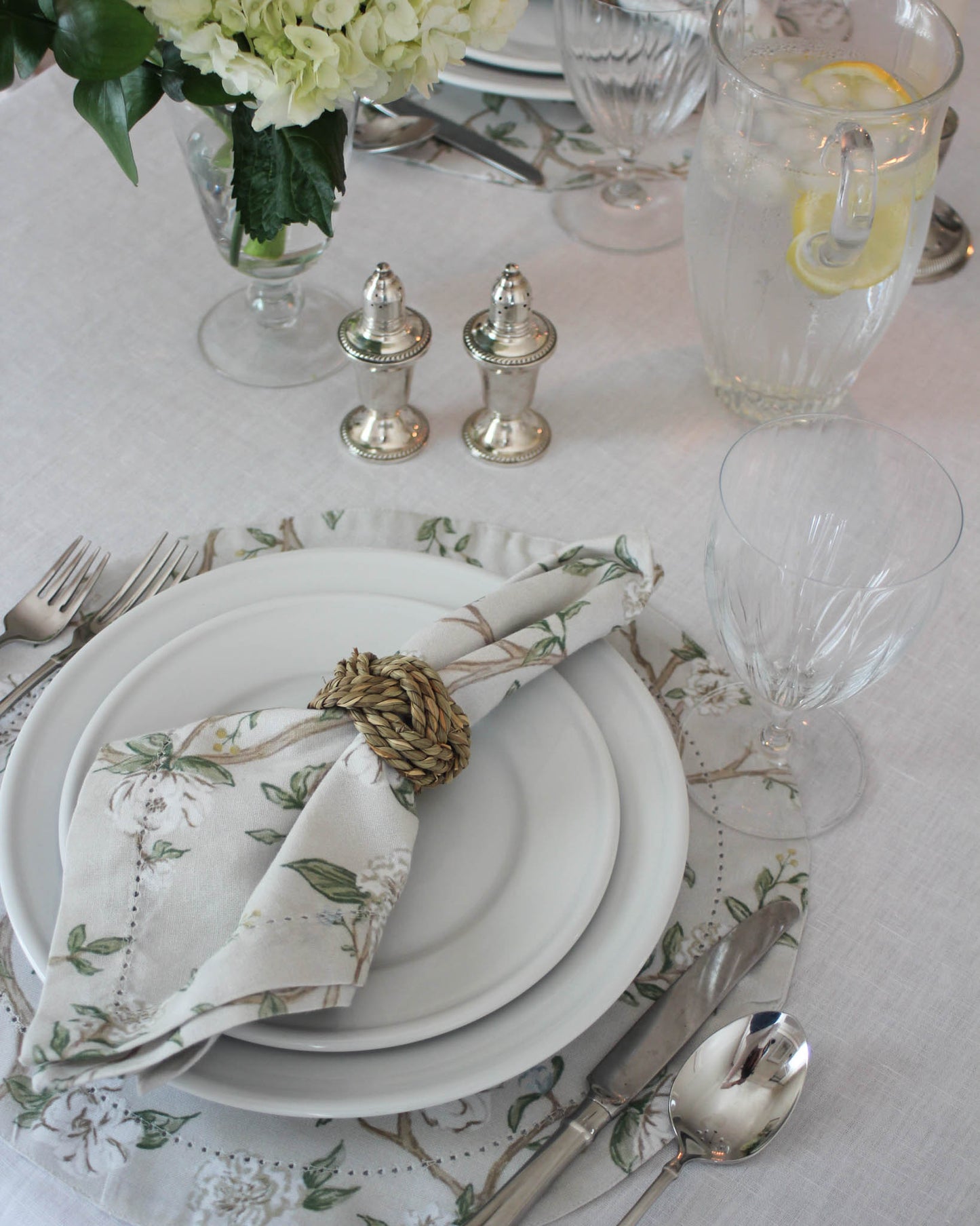 Hand-drawn Camellia floral fabric placemats in timeless beige and green for elegant summer tablescape or Mother's Day gift.