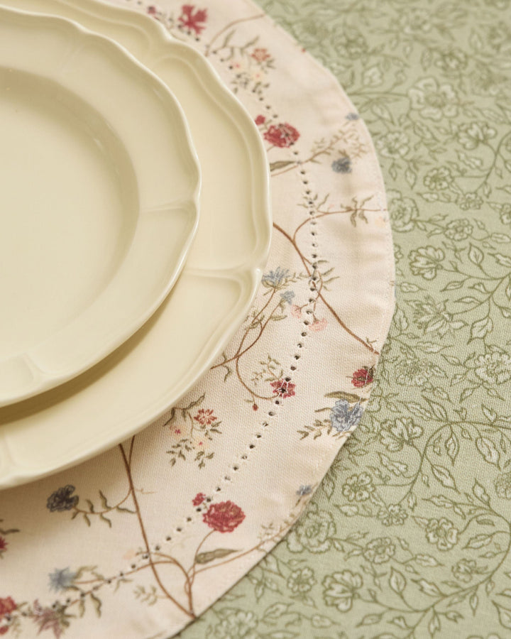 Antique floral placemats with cream, moss green, terracotta, dusty blue, pale yellow, and soft pink botanical details.