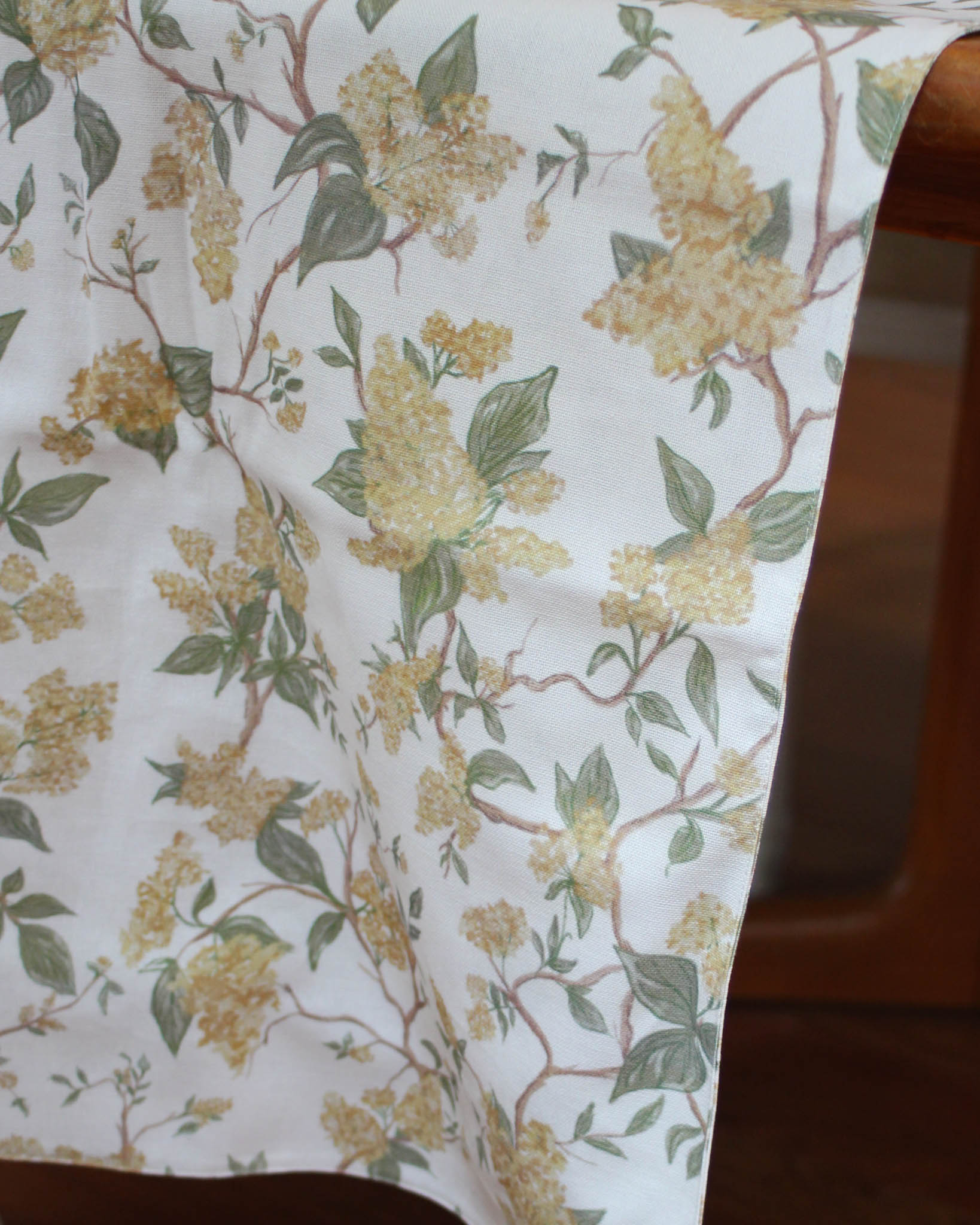 Fall-inspired Hyacinth Marigold floral table runner in sustainable organic cotton for gatherings and entertaining
