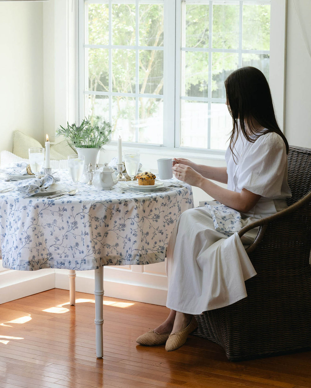 Blue floral cotton round tablecloth styled for refined tablescapes, perfect for hosting and everyday dining