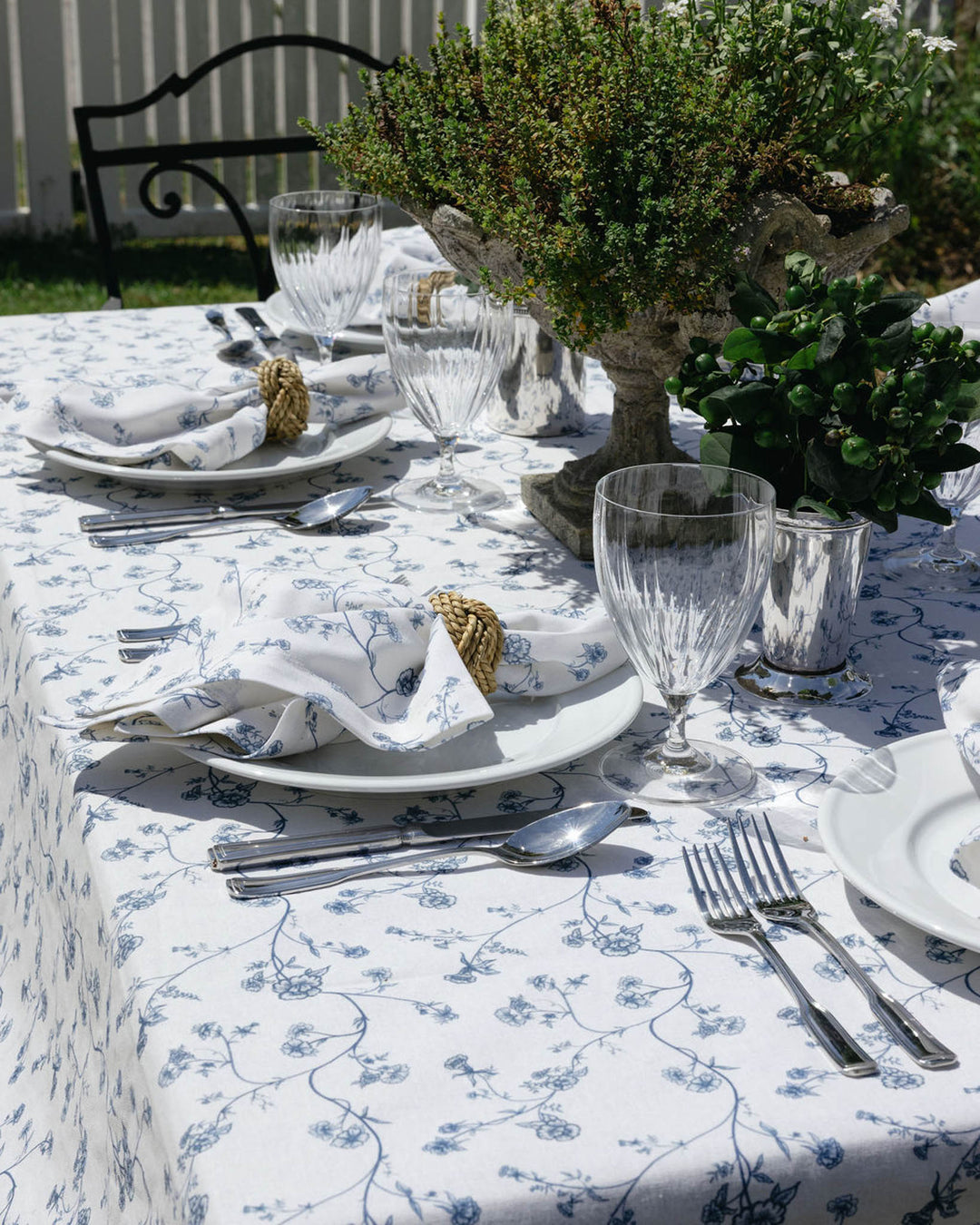 Blue and white floral cotton tablecloth inspired by Delft pottery, ideal for coastal and summer tablescapes