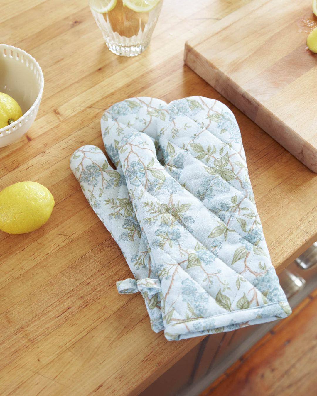 Easter hosting kitchen styled with blue hydrangea cotton oven mitts.