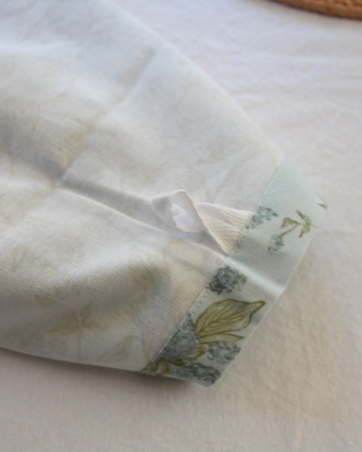 Blue floral tea towel with hanger loop, designed for both function and elegant Southern living kitchen styling.