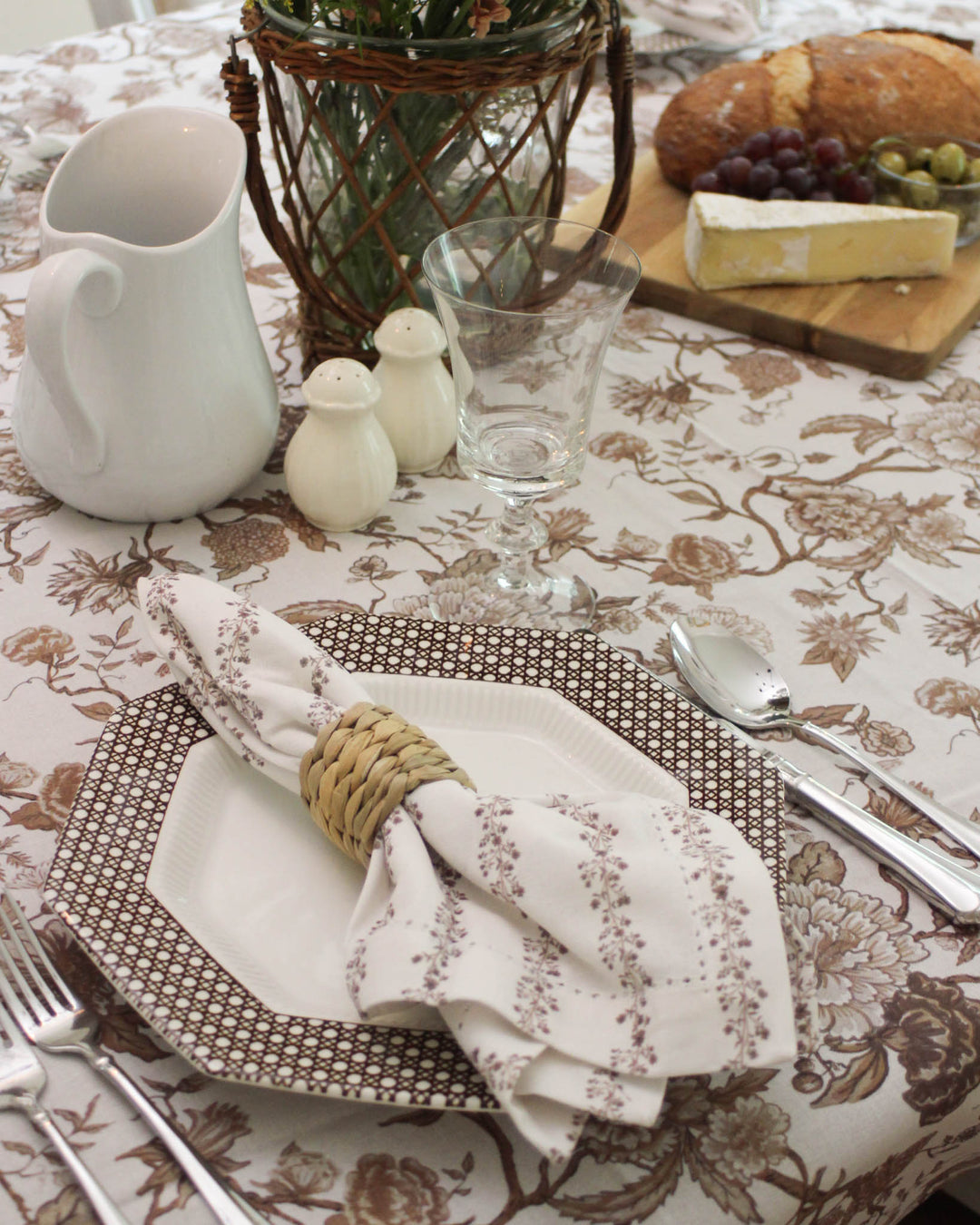 Floral Tablecloth in rectangle sizes 66x104 and 66x120. Spring Tablecloth with a Grand Millennial Decor inspired brown floral print. This Toile Tablecloth pattern is ideal for Easter Table Decor, garden parties, and celebrating Mother's Day Brunch. Hand-drawn with love, this Cotton Tablecloth provides an elegant drape and handcrafted feel. It is a perfect gift for a hostess who loves classic French Country Print designs for long tables.