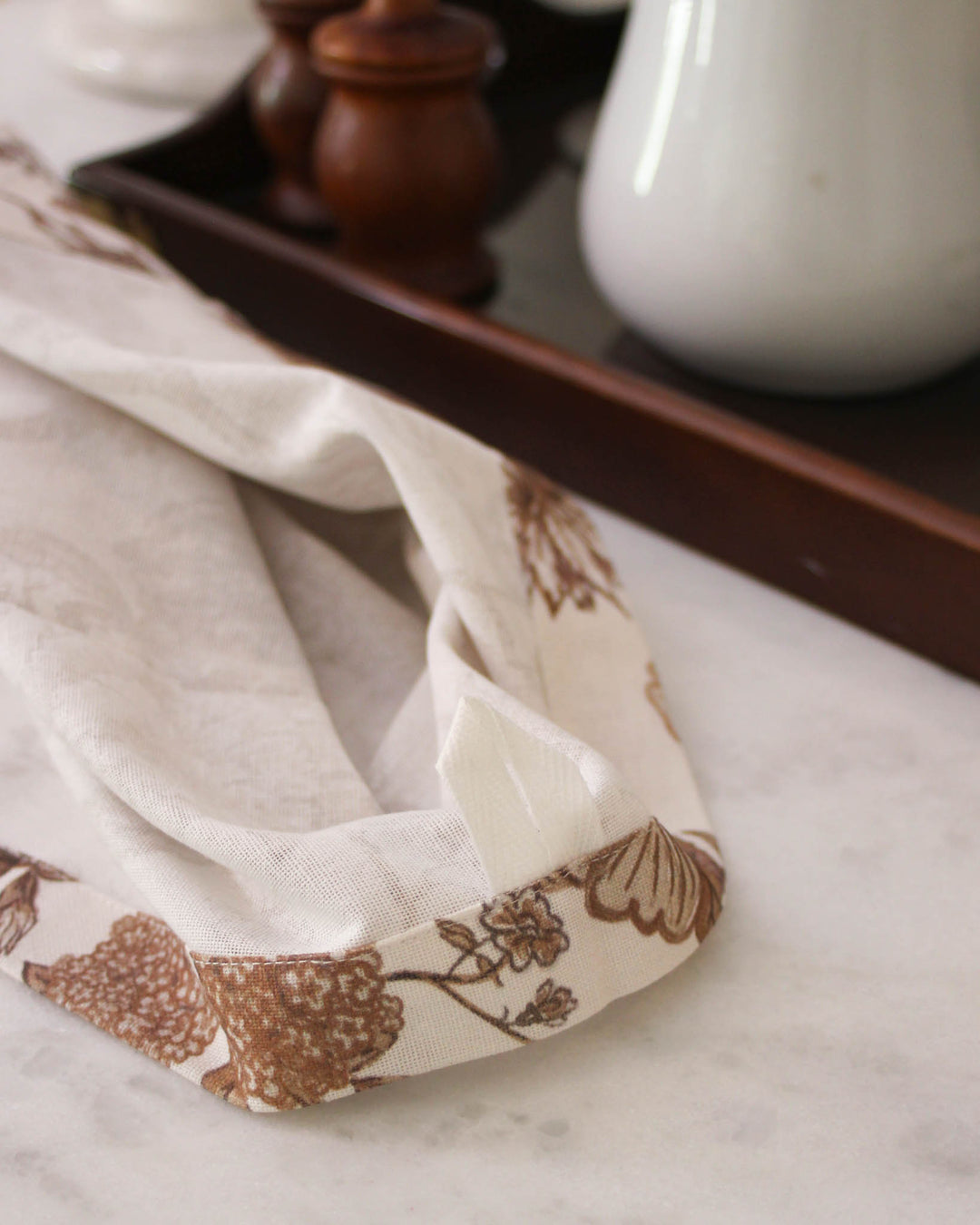 Brown floral kitchen towel with hanger loop, ideal for sourdough baking, food prep, and kitchen styling.