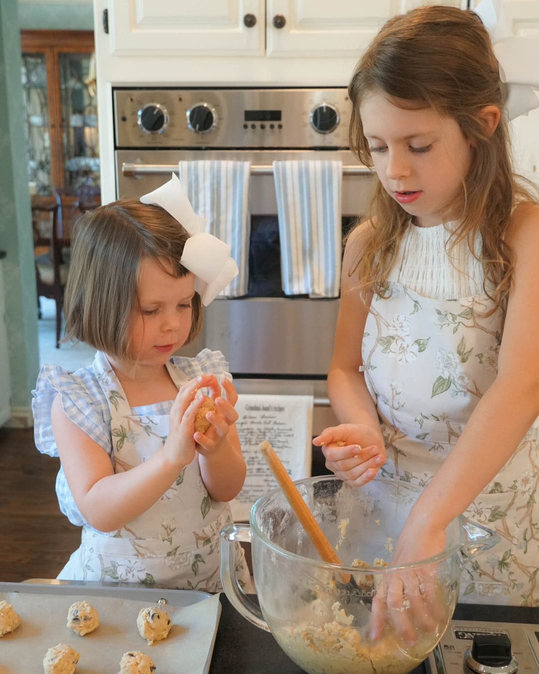 Floral apron for girls with monogram option, a charming birthday or holiday gift for young bakers.