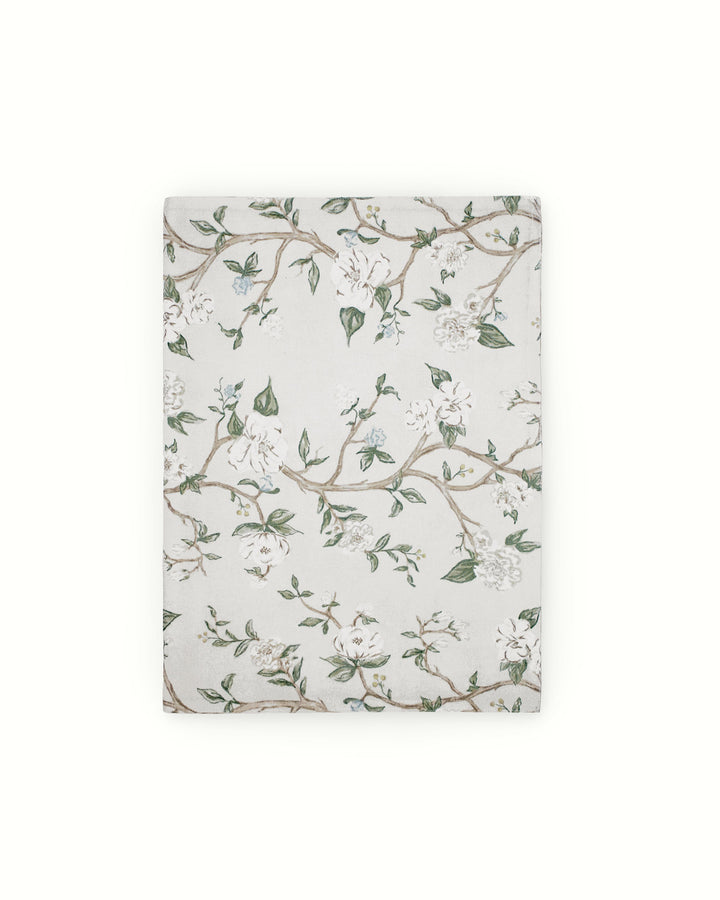 A delightful Chinoiserie floral runner designed for effortless summer hosting. The blue and green hand-drawn botanical design is perfect for outdoor lunches or indoor garden parties. Crafted from 100% cotton, it’s a breathable and elegant choice for spring and summer decor. Pair with coordinating table linens to create a polished, cohesive look. Available in two generous sizes to fit any table. A modern and elegant choice for a bridal shower or a seasonal festive gathering.