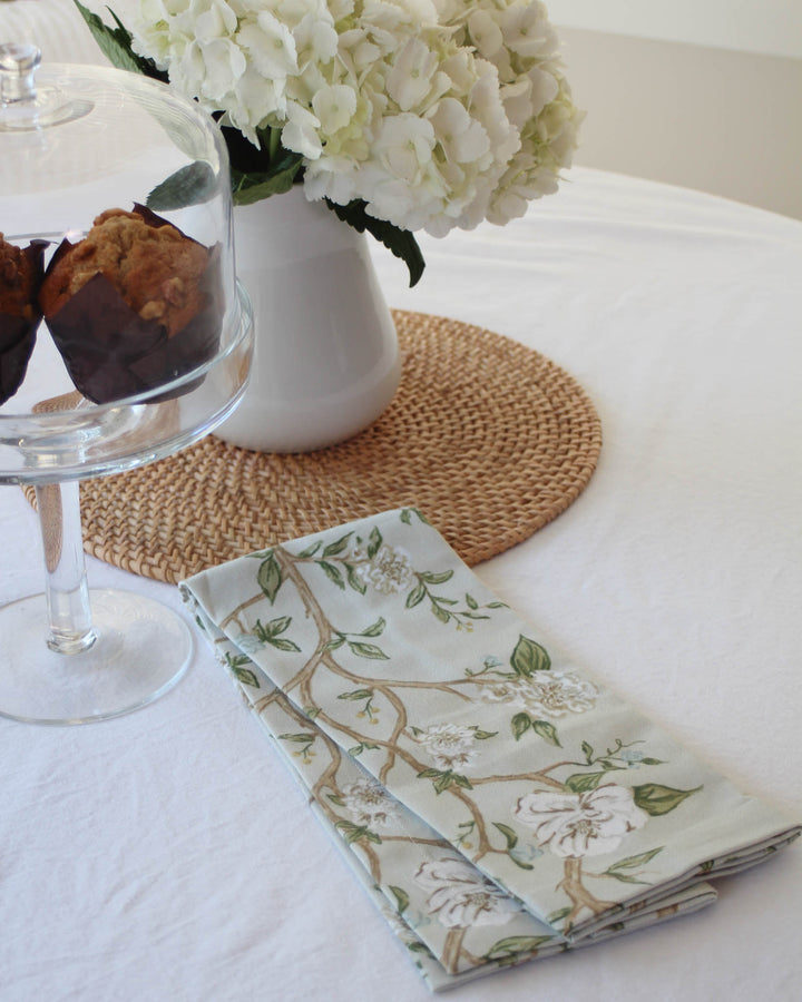 Camellia floral tea towel in 100% cotton with hanging loop, perfect for drying dishes and Southern-style kitchen decor.