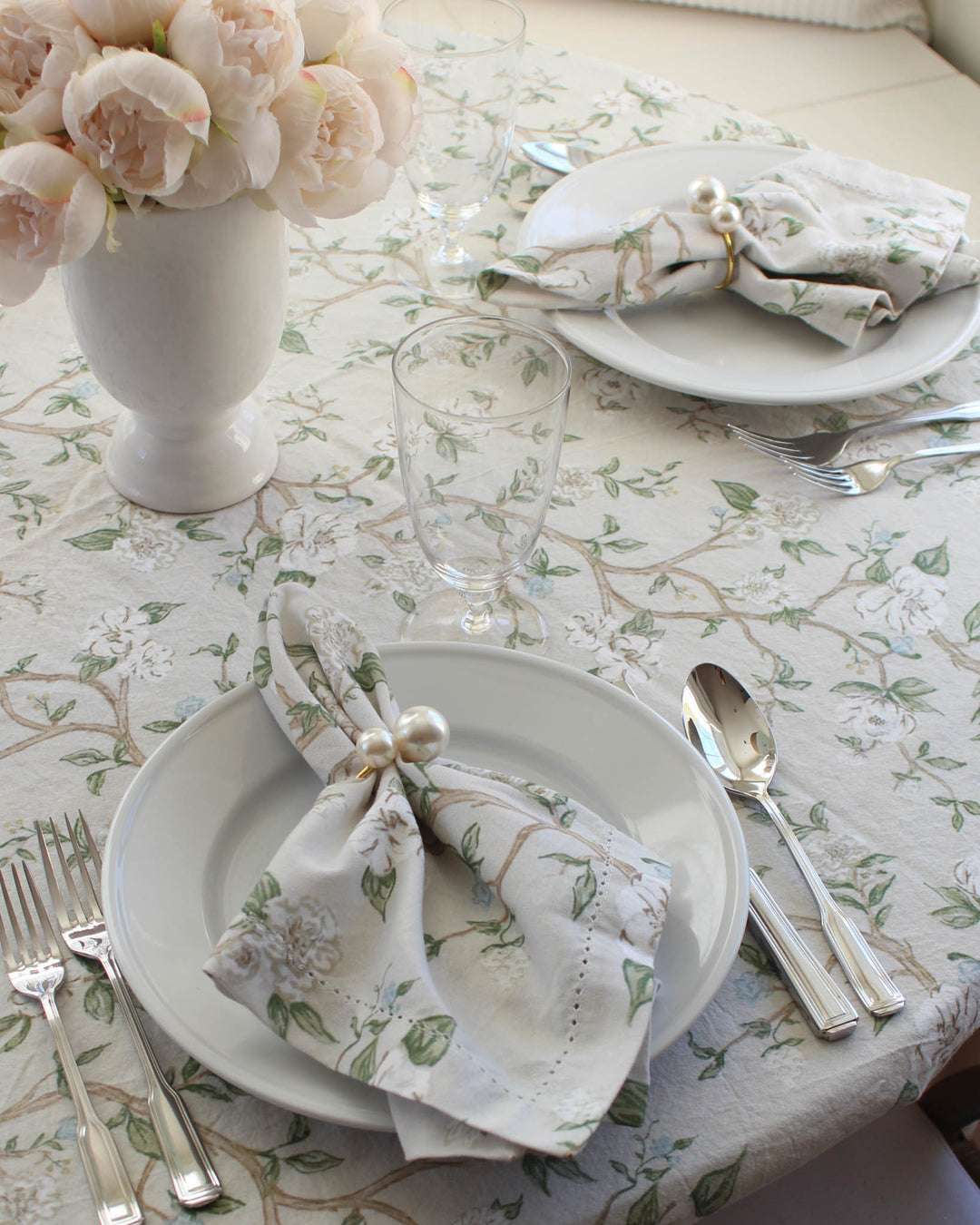 A set of 4 cloth napkins featuring a stunning chinoiserie print with hand-drawn enchanting vines and floral illustrations. Each 20x20 cotton napkin is perfectly sized for formal or casual table settings, ideal for a Mother's Day brunch or wedding decor. These botanical print napkins add warmth to Easter celebrations and festive holiday hosting. A thoughtful gift for mom, grandma, or wife, these exquisite napkins coordinate with our floral tablecloth for a seamless Easter table decor look.