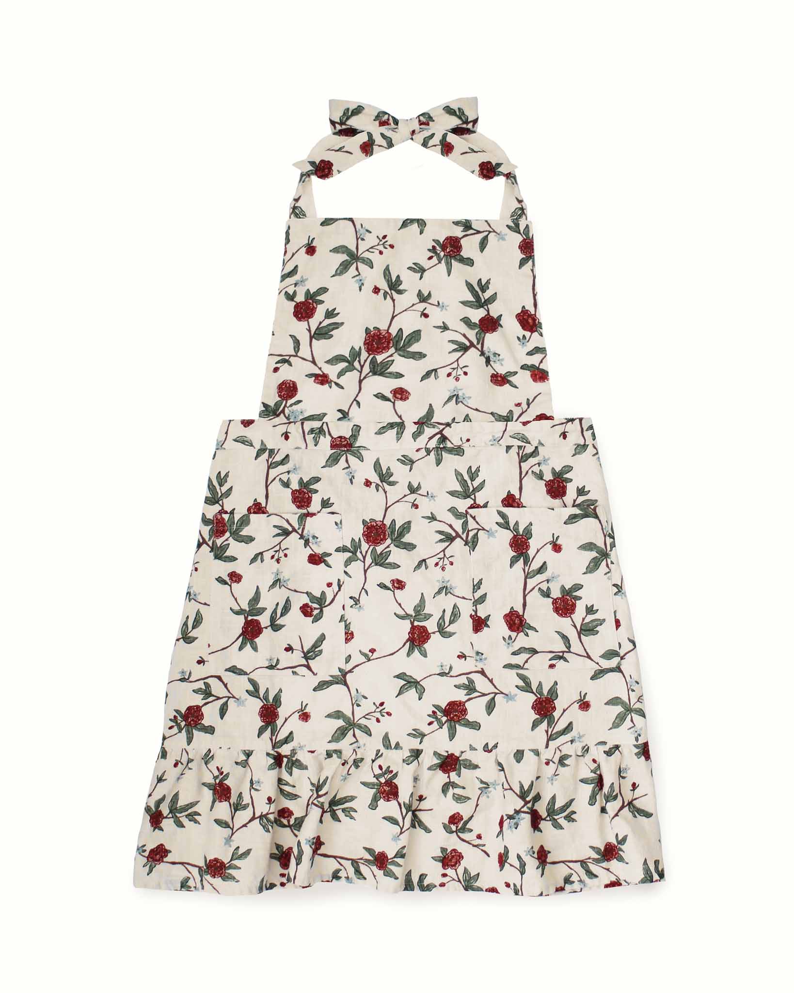 A red floral apron with two functional front pockets, a frill at the bottom, and long ties at the back. The vintage-inspired design combines practicality and charm, perfect for baking, cooking, or as a thoughtful Christmas gift.