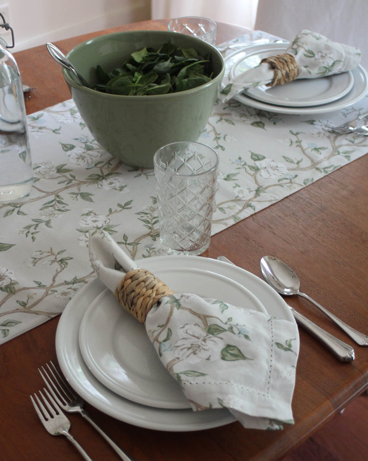 Give your farmhouse table a spring refresh with this Chinoiserie-inspired botanical runner. The charming blue and green flowers and leaves are hand-drawn with love on a 100% cotton base. This runner provides a soft, elegant contrast to rustic wood furniture. Ideal for Easter table decor, Mother’s Day brunch, or daily summer meals. Durable and machine-washable, it’s designed for real-life hosting while maintaining a high-end, polished look for your guests.