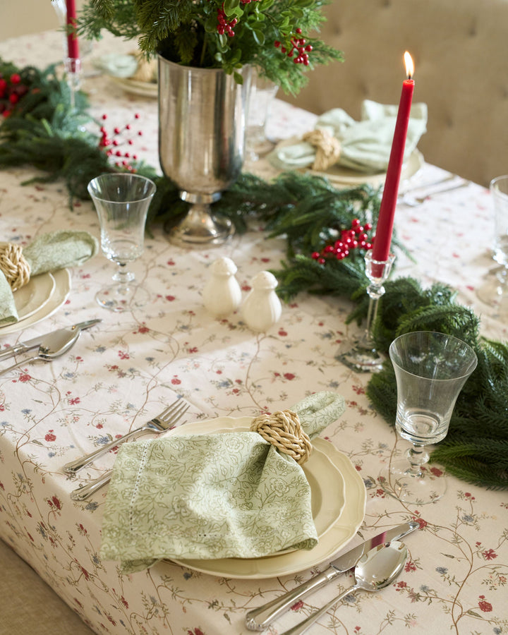 Elegant cotton cloth napkins in soft neutral tones, styled for a classic Christmas table setting and holiday entertaining.