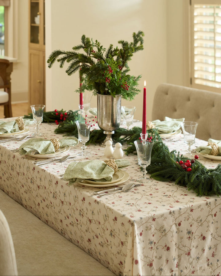 Elegant neutral floral cotton tablecloth styled for a traditional Christmas table setting with timeless holiday decor and natural accents.