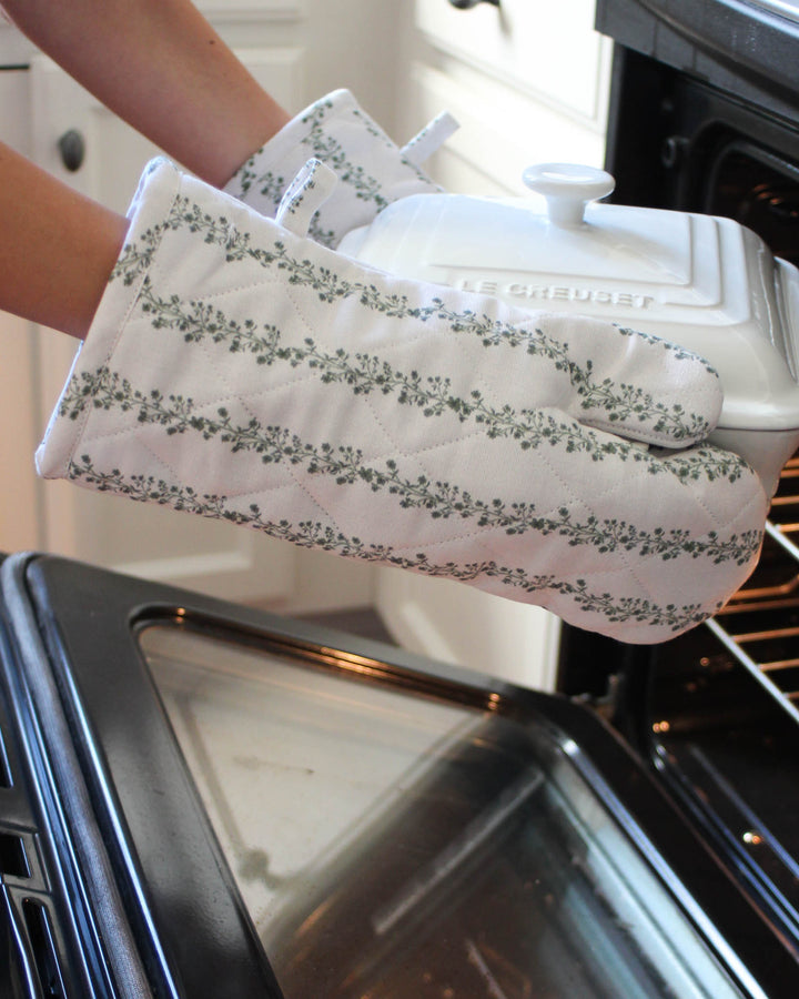 Cotton kitchen gloves in green floral stripe print, perfect for home cooks, bakers, and everyday meals.