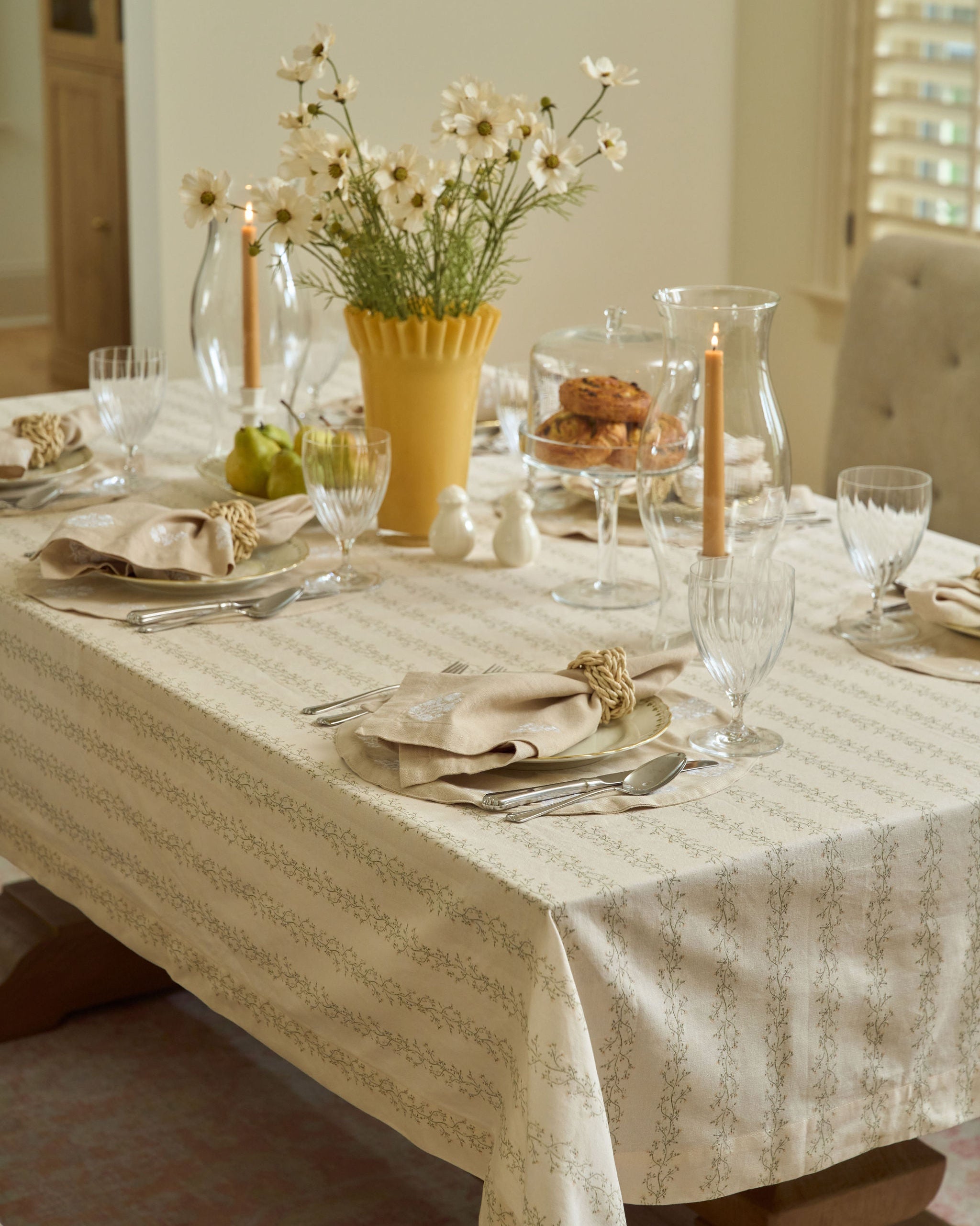 Neutral floral stripe tablecloth in sage green, pale yellow, and tan for Easter brunch, spring hosting, fall gatherings, and Thanksgiving dinner.