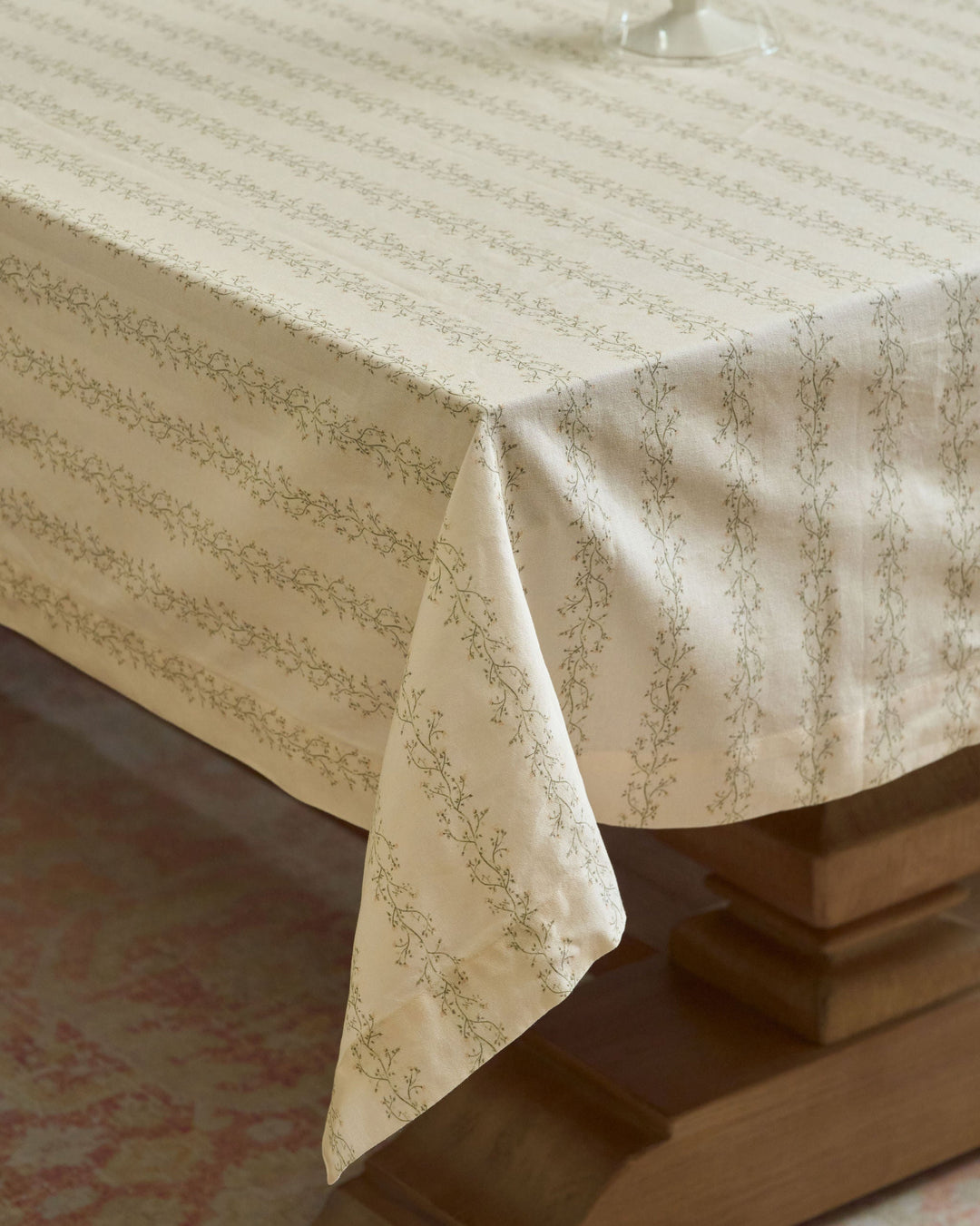 Cream floral stripe tablecloth with green and yellow botanicals for Easter gatherings, spring lunches, and wedding tables.