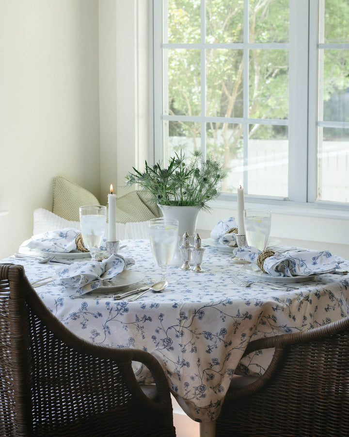 Round tablecloth in Delft blue floral cotton, inspired by antique patterns and designed for elegant table settings