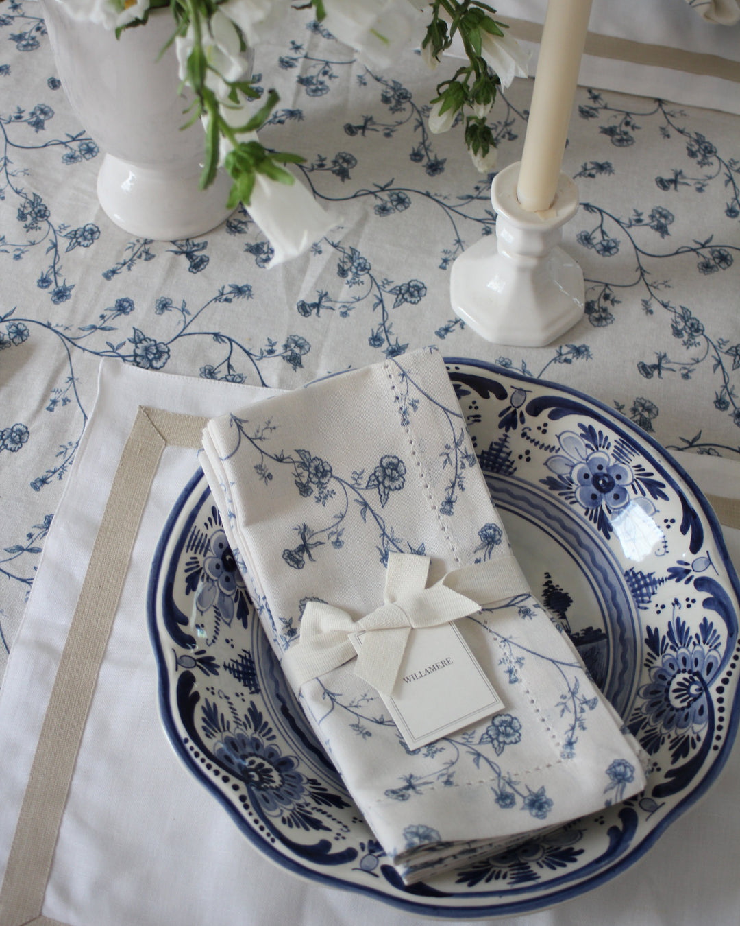 Garden Vine cotton napkins in Delft Blue with hand-drawn floral print, bringing a light and timeless feel to summer hosting.