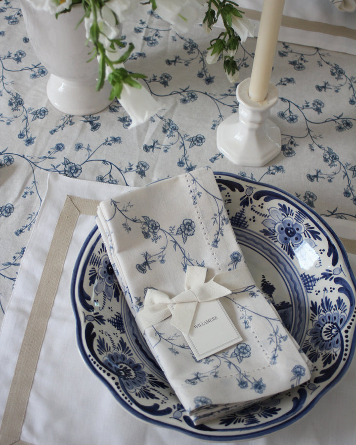 Garden Vine cotton napkins in Delft Blue with hand-drawn floral print, bringing a light and timeless feel to summer hosting.