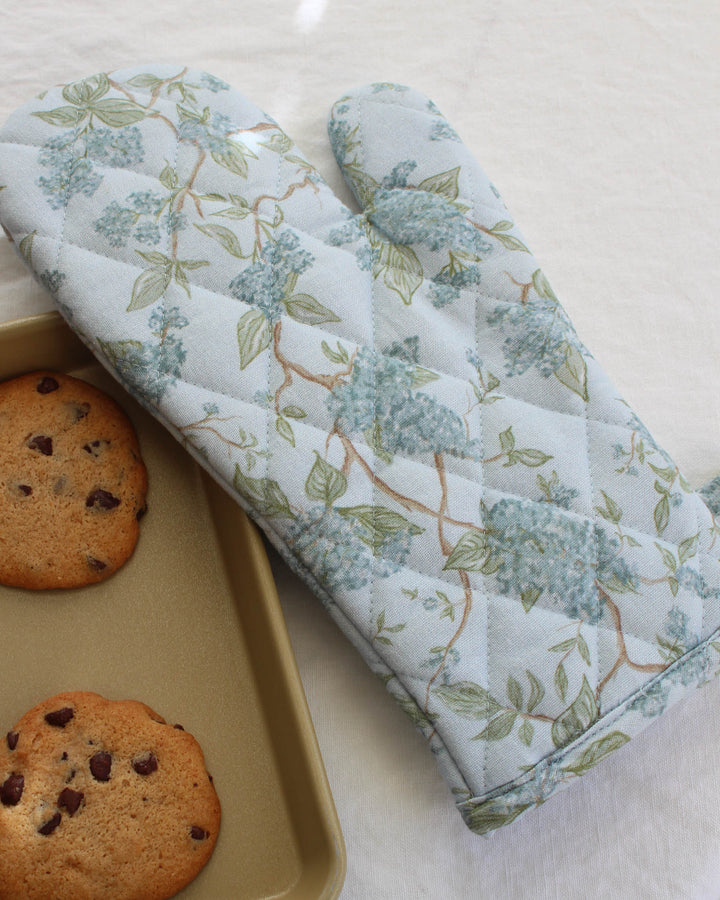 Hydrangea print cotton oven mitts designed for spring cooking and entertaining.