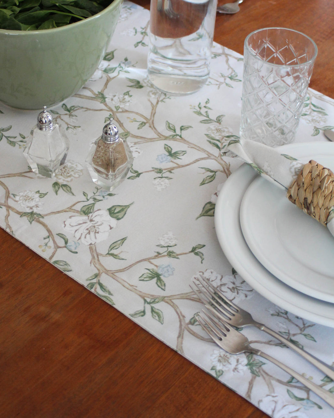 The perfect Easter hostess gift or housewarming present, this Chinoiserie floral cotton table runner is both practical and beautiful. The soft blue and green hand-drawn botanical design elevates any holiday decor. Available in 104" and 120" sizes, it’s ready to transform a friend’s dining space into a spring oasis. High-quality natural fibers ensure it remains a cherished part of their linen collection for years. A sophisticated way to say thank you for a wonderful meal.