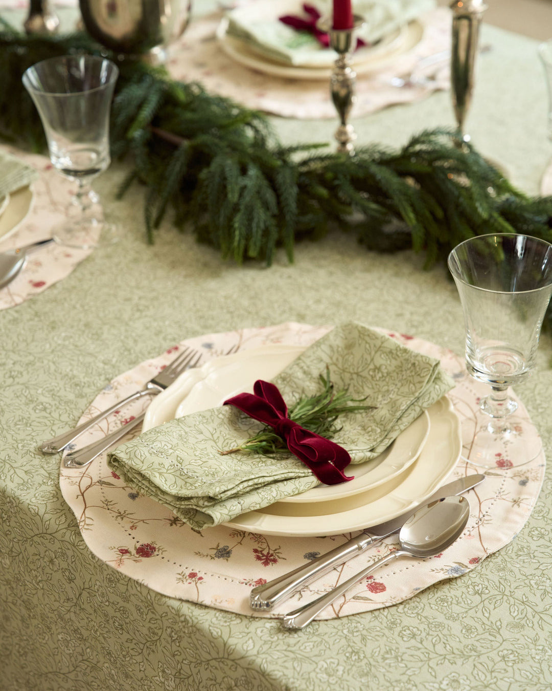 Hand-drawn floral cotton tablecloth featuring delicate botanical details for a traditional Christmas tablescape with understated holiday styling.