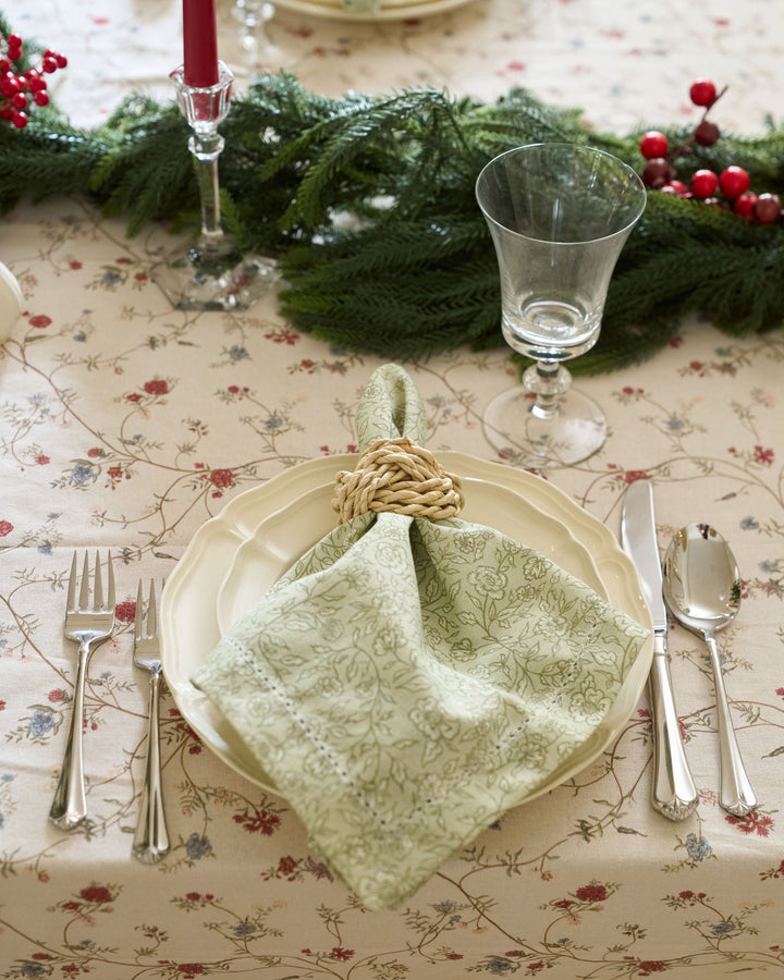 Classic neutral cotton tablecloth featuring a delicate floral print, perfect for traditional Christmas dining and holiday entertaining.