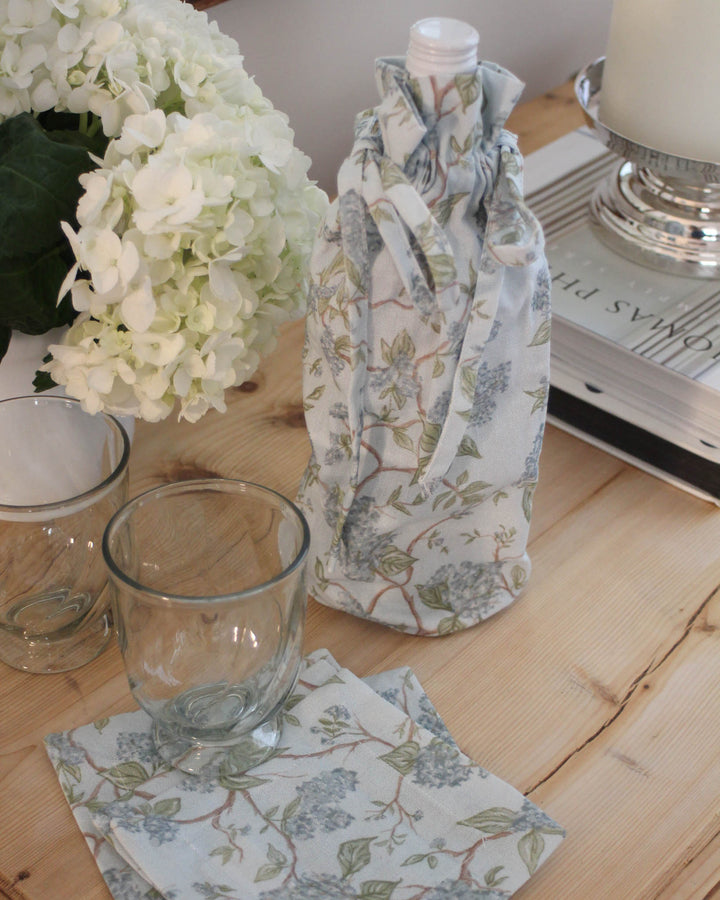 Elegant floral wine gift bag designed for weddings, anniversaries, and thoughtful hostess gifts.