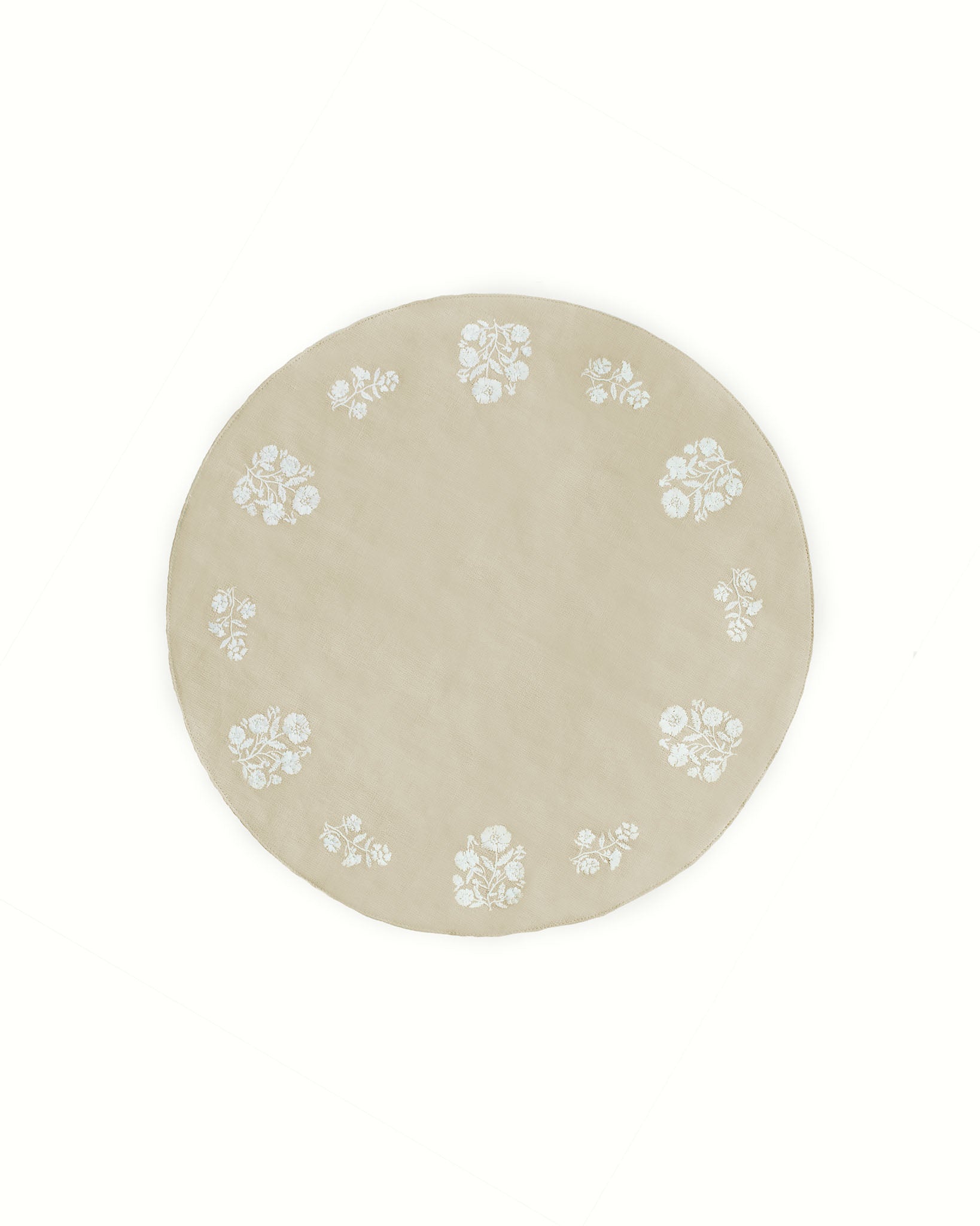 Set of 4 classic round placemats in a neutral beige color, featuring delicate white floral embroidery. Perfect for Easter, spring, and summer tablescapes, these timeless placemats add charm and sophistication to any dining setting.