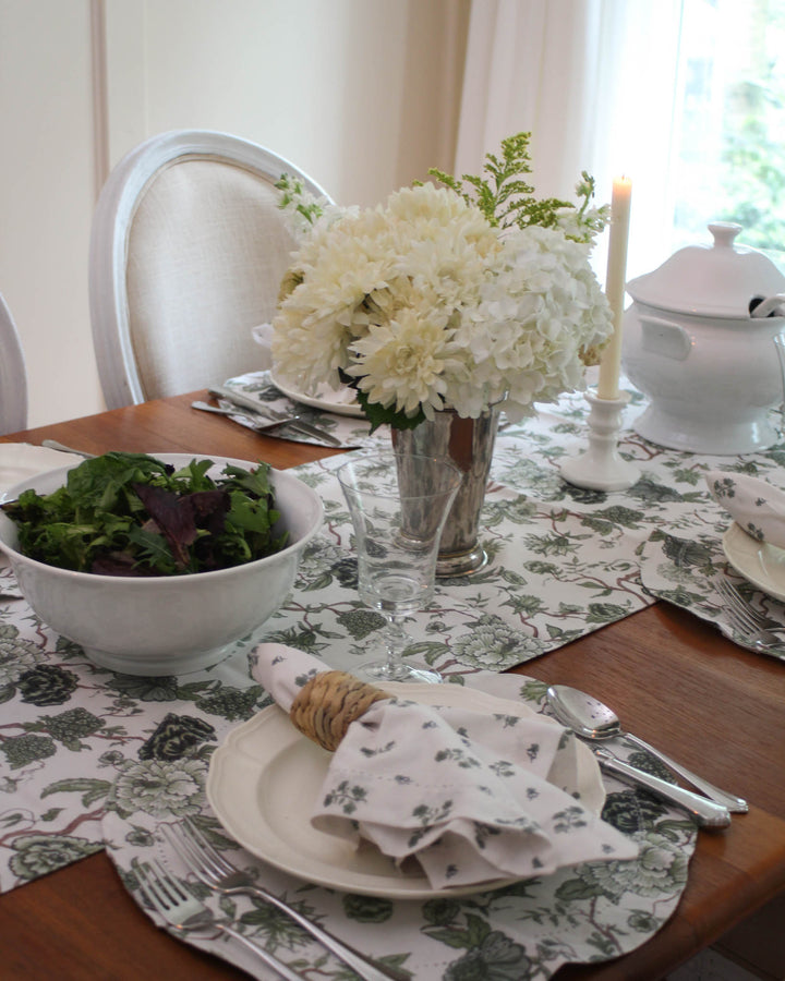 Fern green cotton table runner with hand-drawn floral design. A warm, inviting accent for spring summer gatherings. Pairs beautifully with matching napkins and placemats for a perfect Mother's Day, Easter table decor