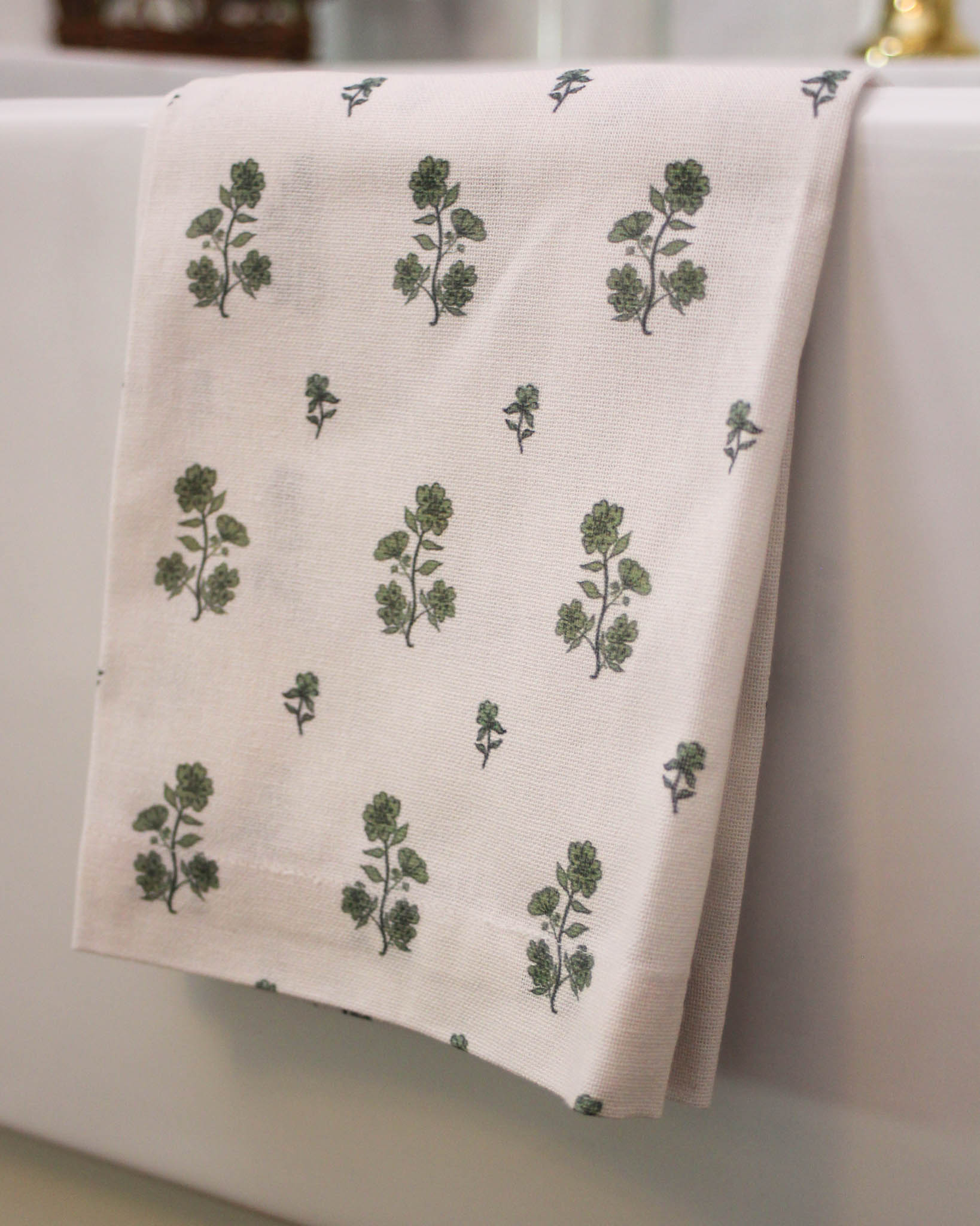 Hand-drawn floral bouquet pattern detail on cream organic cotton tea towel. 17" x 25" in size 