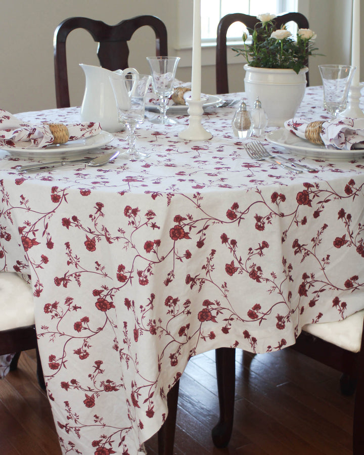 Red Floral Rectangle Tablecloth available in 66x104 and 66x120 inch sizes. Featuring a delicate French Country print with hand-drawn red flowers, this Cotton Tablecloth is a stunning choice for Easter Table Decor or a festive Mother's Day Brunch. The Grand Millennial Decor style offers an elegant drape for long tables. Use this Floral Tablecloth to bring warmth to your dining room. A perfect Spring Tablecloth for family gatherings and holiday hosting.