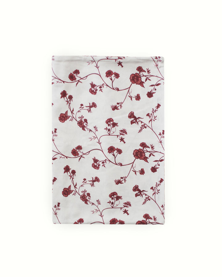 A stunning red botanical table runner for your spring or summer garden party. This hand-drawn floral design on premium 100% cotton adds a preppy, elegant touch to outdoor wedding receptions or bridal showers. Available in extra-long 120-inch lengths for banquet tables. Pair with coordinating linens for a seamless, polished look. This modern and elegant runner is a must-have for those seeking a "coastal daughter" or classic botanical-inspired wedding theme.