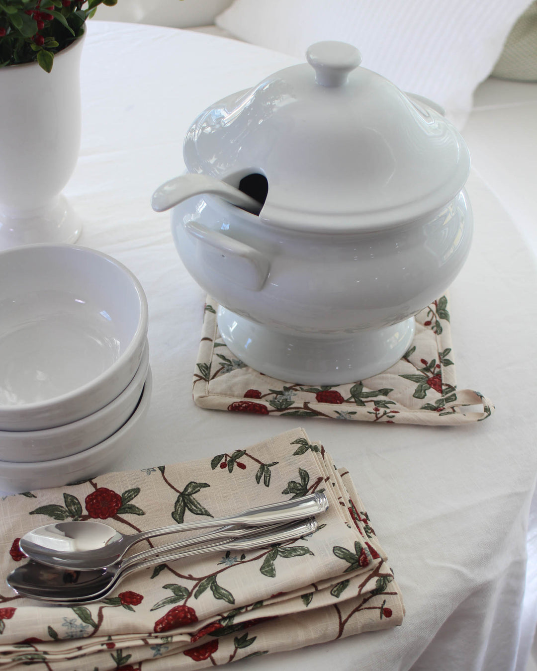 Featuring a vibrant red and green floral print, these quilted potholders are a must-have for grand millennial decor. This set of 2 woven potholders is made from premium cotton with recycled insulation for safe kitchen use. Each 8x8 square potholder has a loop for easy hanging. Use them as quilted trivets or floral hot pads during Easter baking. These make a wonderful Mother's Day gift for mom or grandma gift, offering a practical and beautiful addition to any spring kitchen set.