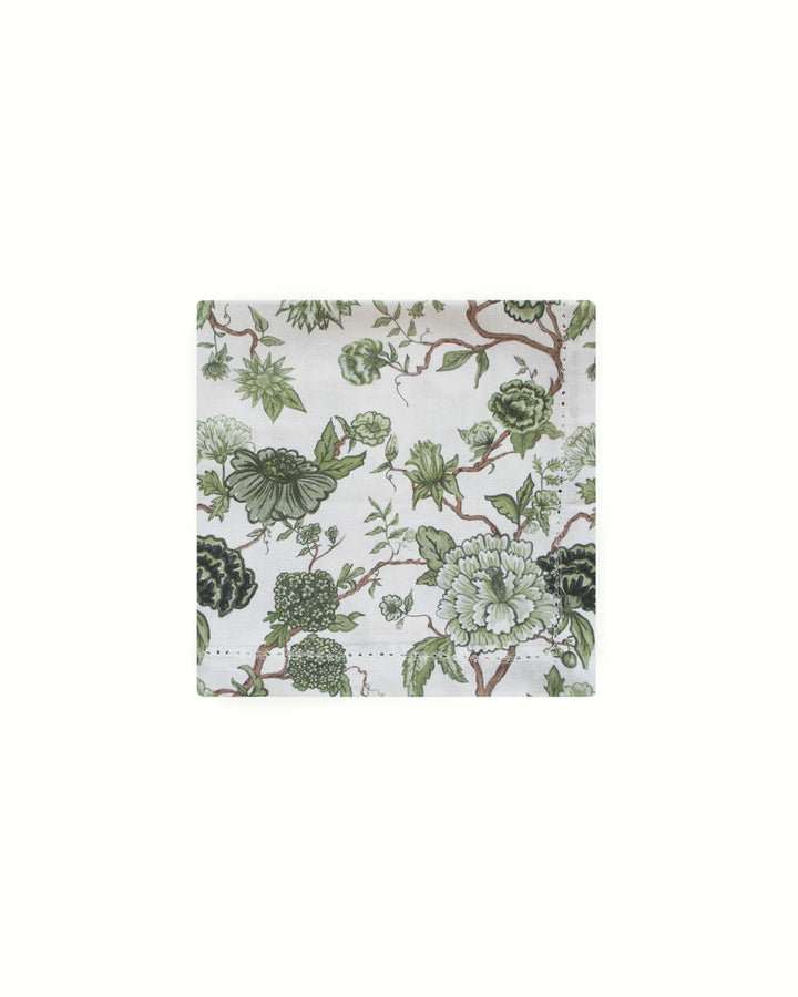 Create a vintage English garden look with these green leaf print cotton napkins. Sold in a set of 4, the 20" x 20" dimensions allow for elegant draping and layering. The hand-drawn green floral illustrations add a touch of warmth to any Easter or Mother's Day brunch. These napkins are not just decor; they hold space for memories made around the table. An ideal gift for a hostess or a housewarming present, they work perfectly for both formal dinner parties and casual family meals.