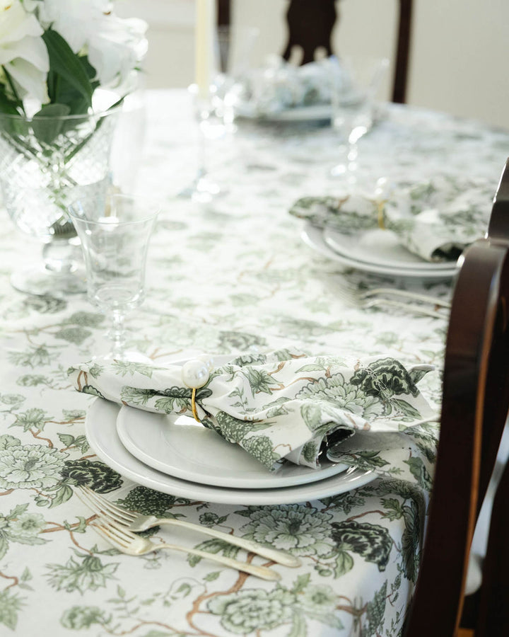 Set of green floral cotton napkins styled for a summer table setting, perfect for hosting, dining, and gifting