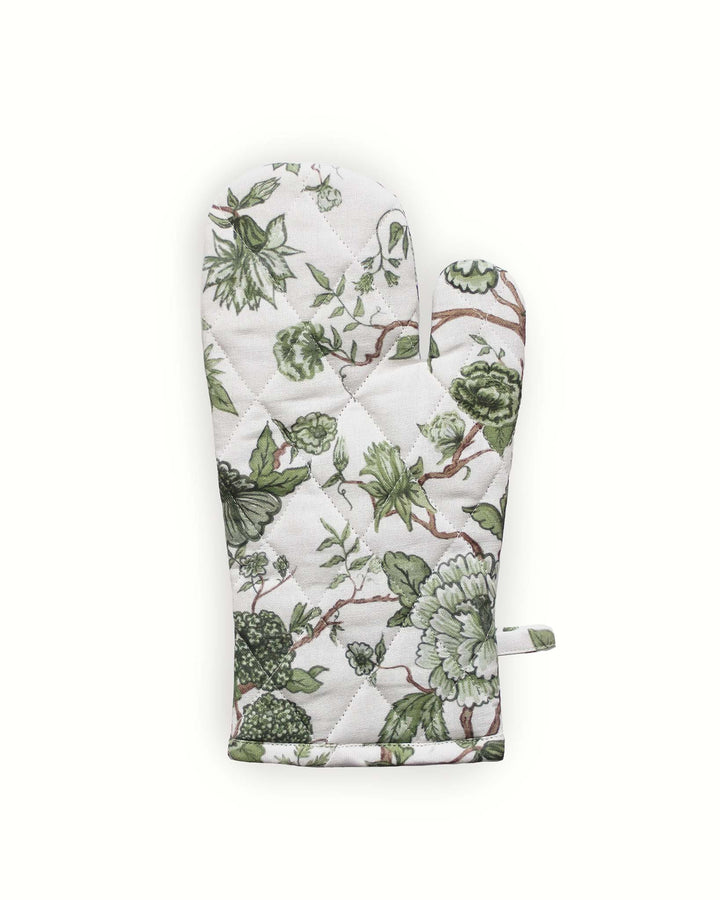 Vintage-inspired green floral oven mitts that offer a timeless aesthetic for the grand millennial kitchen. Handcrafted from high-quality cotton, these long kitchen gloves feature heat-resistant insulation and a quilted diamond pattern. The generous 7x13.5 inch sizing provides excellent protection for safe cooking and baking. These botanical mitts are a charming and practical gift for mom or a favorite baker, blending sustainable recycled cotton fill with a beautiful floral print.