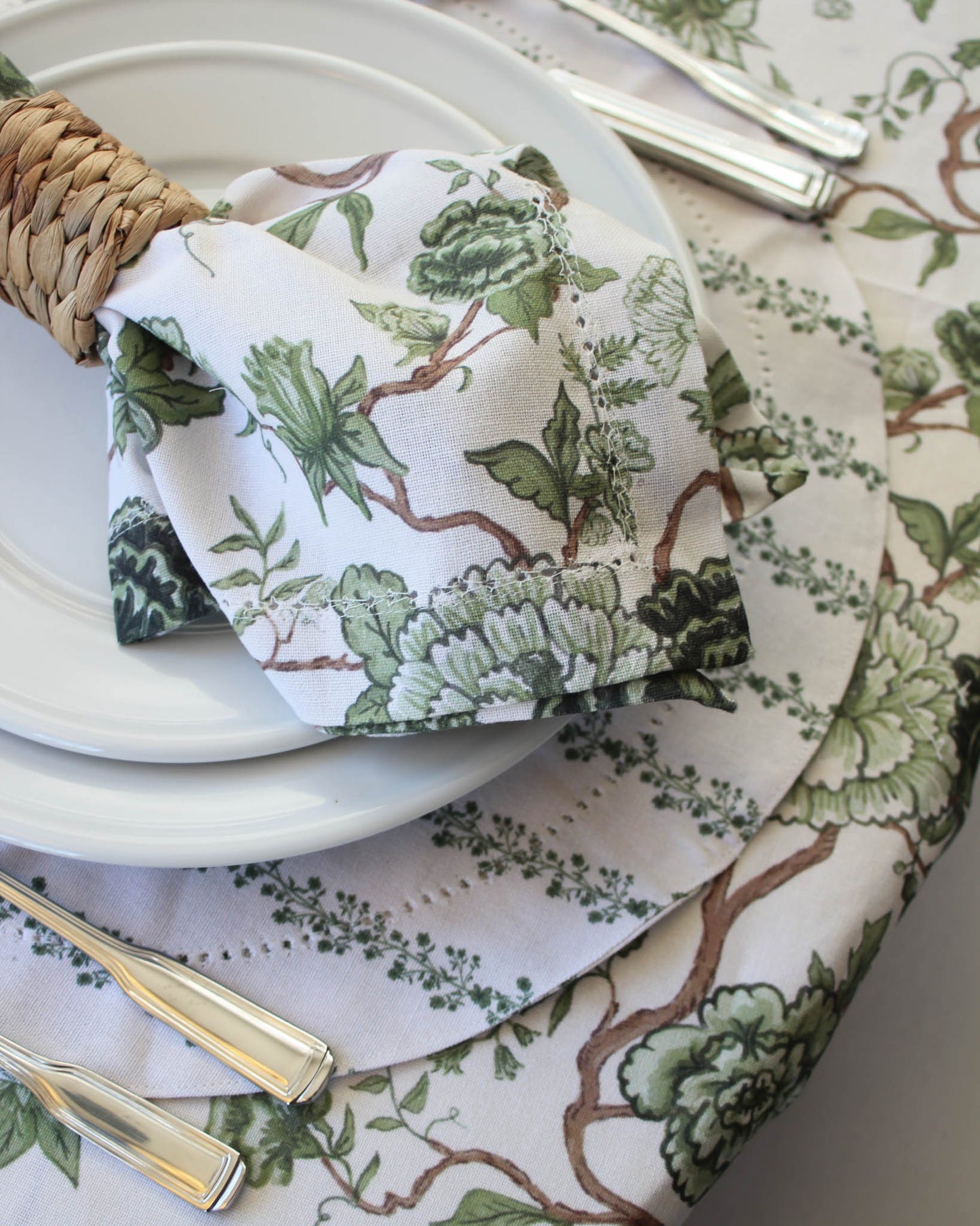 Green floral patterned napkin and tablecloth with green stripe placemat