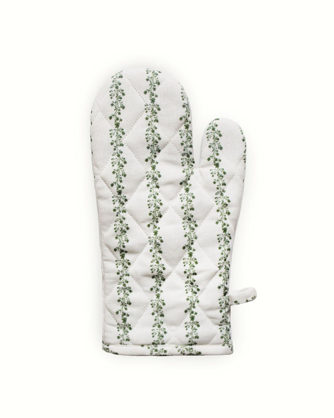 Intricate diamond-quilted oven mitts in a signature  green floral striped print. Every stitch reflects a commitment to heirloom quality and artistic design. These long kitchen gloves are perfect for protecting your hands from hot trays while maintaining an elegant, high-end look. The hand-drawn floral vines make these mitts a beautiful focal point when hanging in your kitchen, blending traditional artistry with everyday practical functionality.