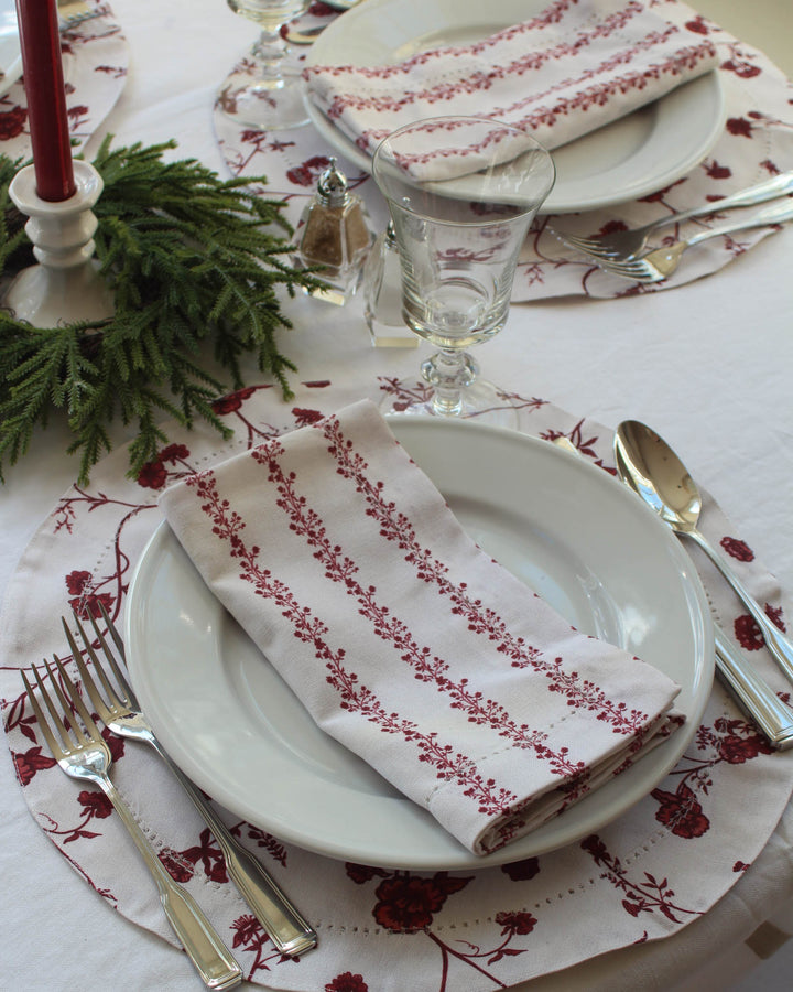 Hand-drawn floral round placemats that pair beautifully with matching napkins and tablecloth. Perfect for holiday hosting or gifting