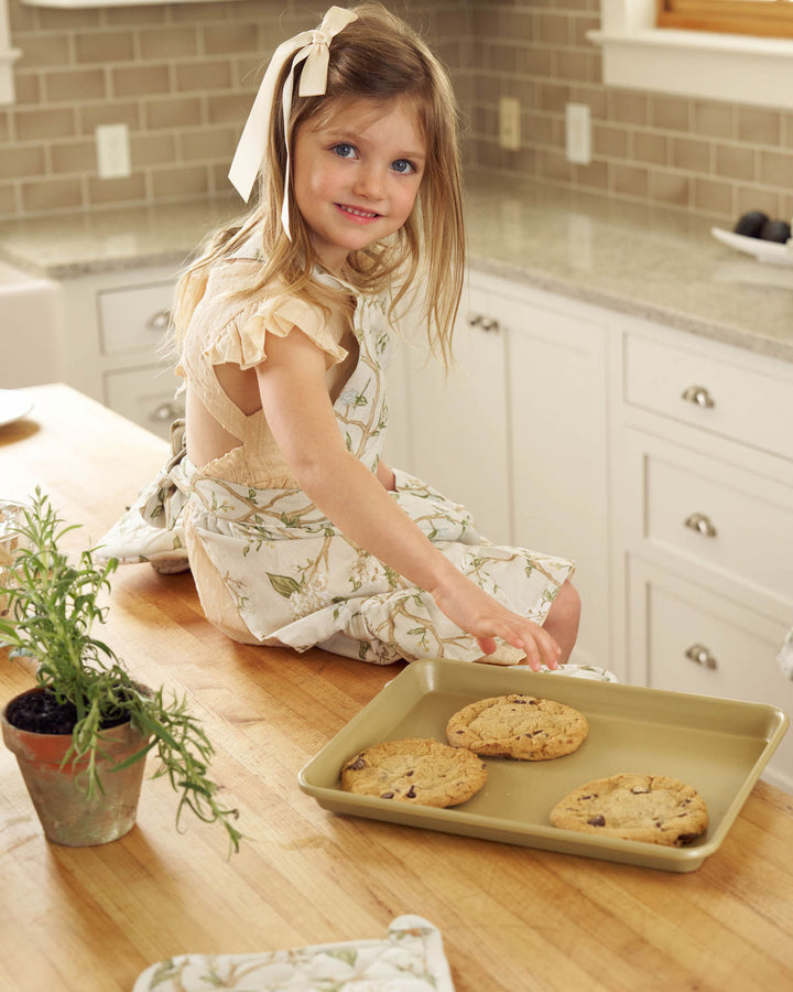Camellia kids apron with adjustable waist ties, perfect for cooking, crafts, and thoughtful gifting.