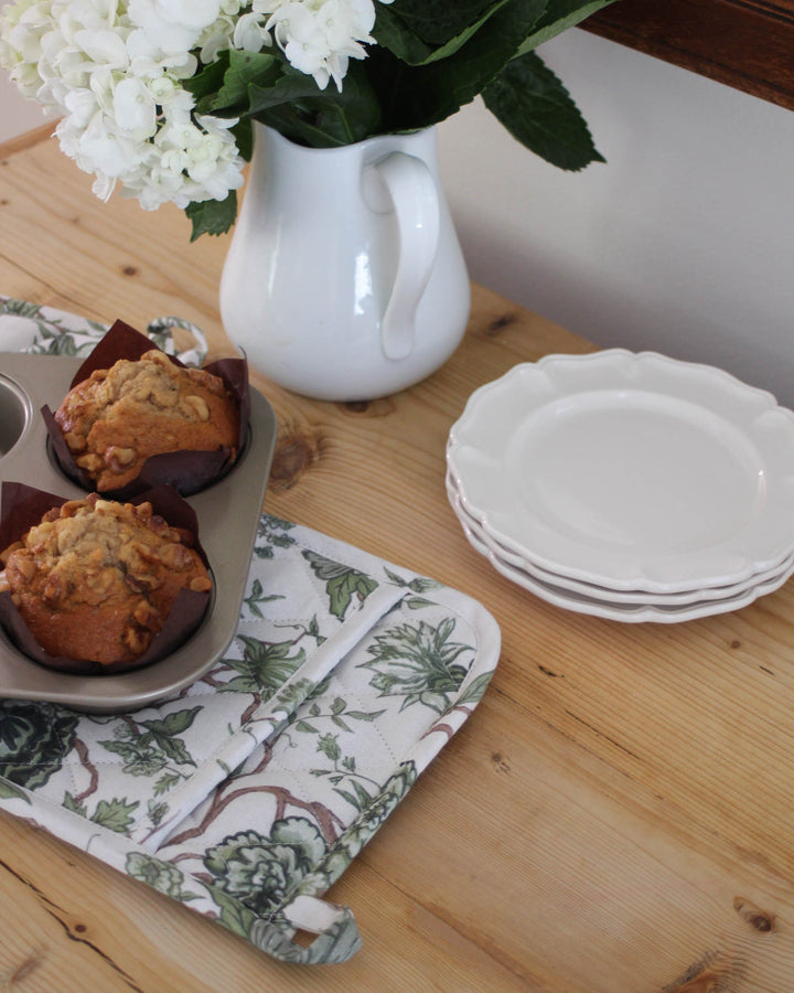Florence cotton potholders in green floral print, styled for a refined coastal and Southern-inspired kitchen.