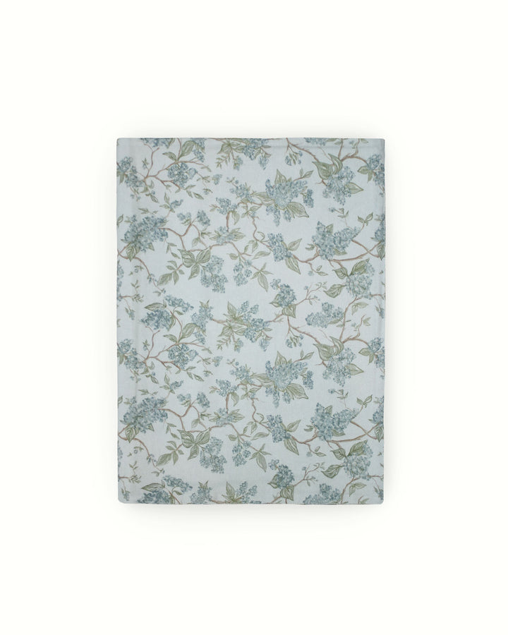 Perfect for an afternoon tea or a ladies' luncheon, this blue Chinoiserie runner brings a soft, elegant touch to the table. The hand-drawn flowers and greenery create a sophisticated backdrop for petit fours and finger sandwiches. Made from 100% cotton, it’s a breathable and luxury choice for spring and summer decor. Its timeless pattern reflects a commitment to classic Southern style, making every small gathering feel like a special, thoughtfully put-together occasion.