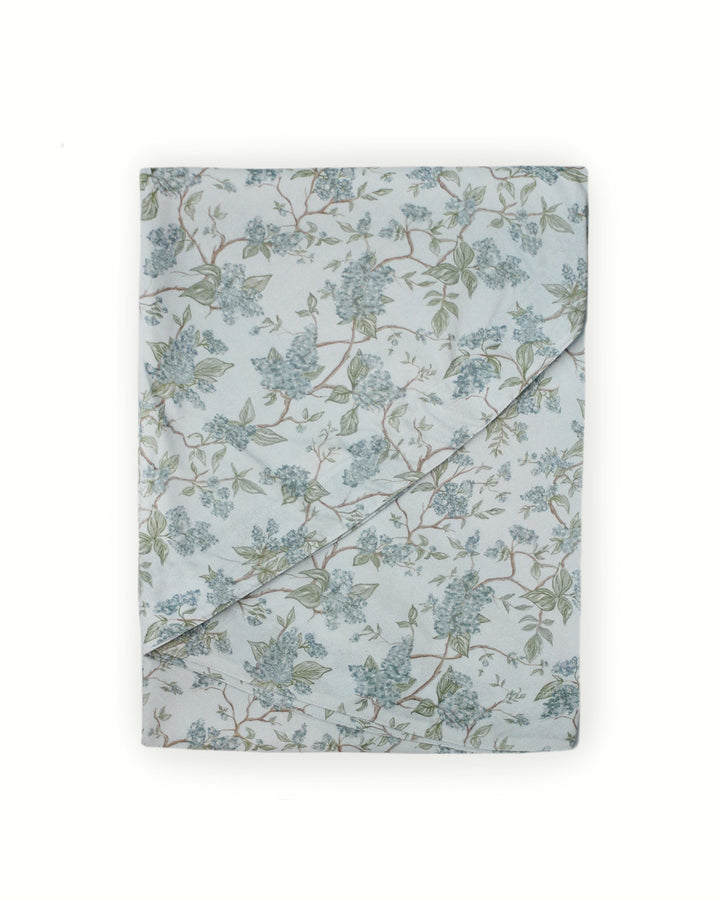 Chinoiserie print wedding tablecloth featuring soft blue and green floral vines on 100% cotton. This rectangle and round tablecloth is ideal for wedding reception tables, Easter brunch decor, or Mother’s Day gatherings. Designed in Charleston and ethically crafted in India with non-toxic dyes, it brings a refined farmhouse and French country aesthetic to garden parties, rehearsal dinners, and spring entertaining.