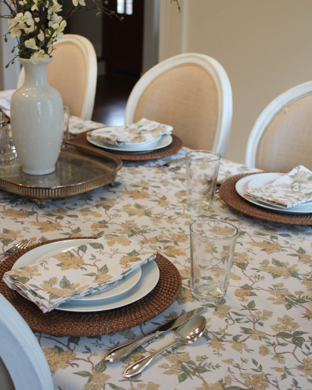 Spring yellow floral cotton tablecloth styled for spring summer entertaining and seasonal hosting.
