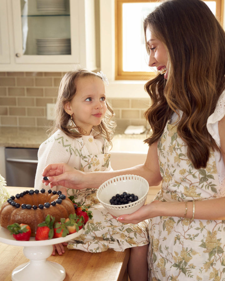 Matching mommy and me cotton aprons in a warm marigold yellow, designed for meaningful Mother’s Day moments.